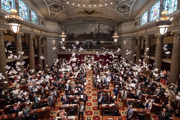 House members toss papers as session ends